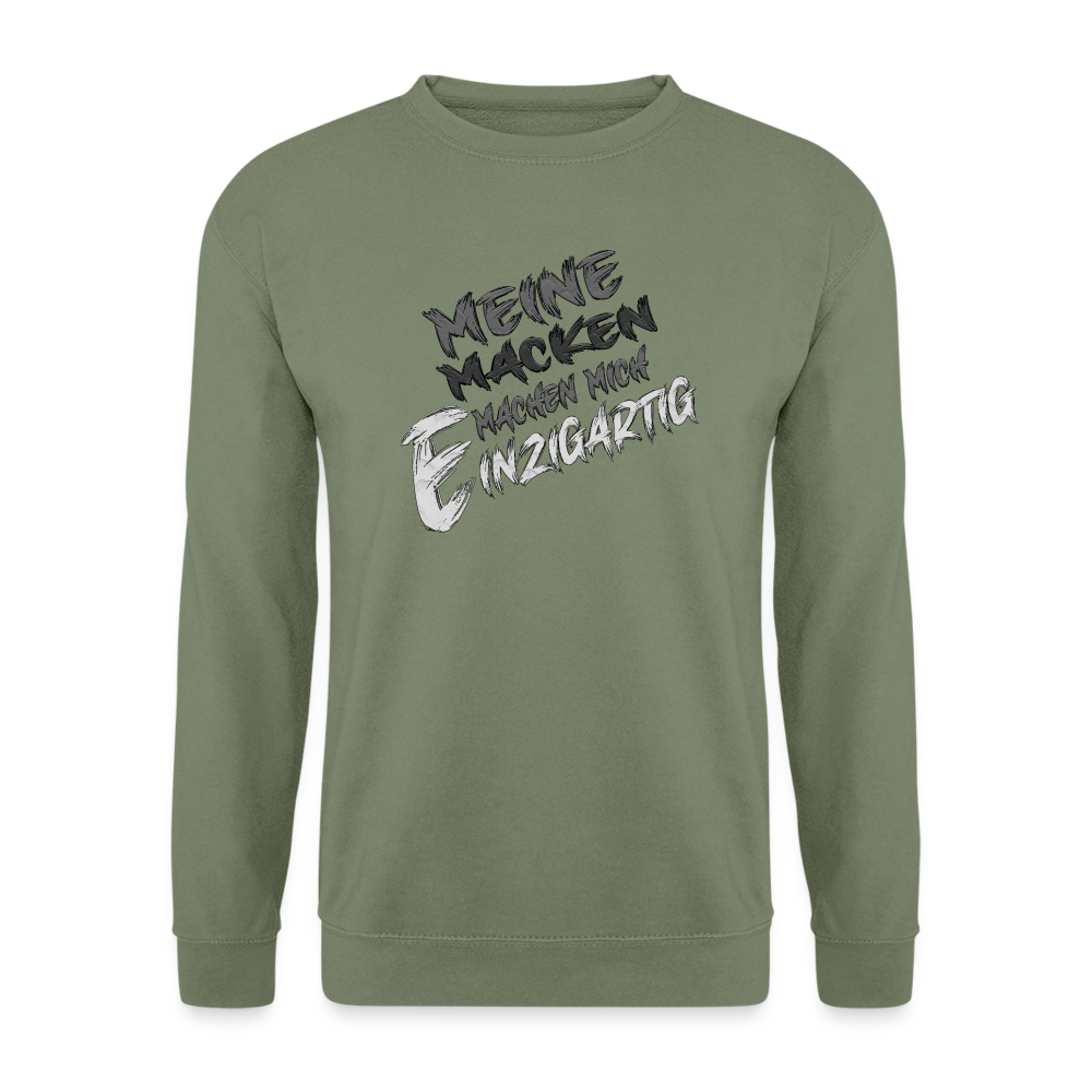 Armeegrüner Streetwear Pullover für Frauen und Männer mit einzigartigem Statement Spruch auf der Brust „Meine Macken machen mich magisch“. Ideal für Freizeit und Alltag . Modisches Design. Klassischer Schnitt und Humor.