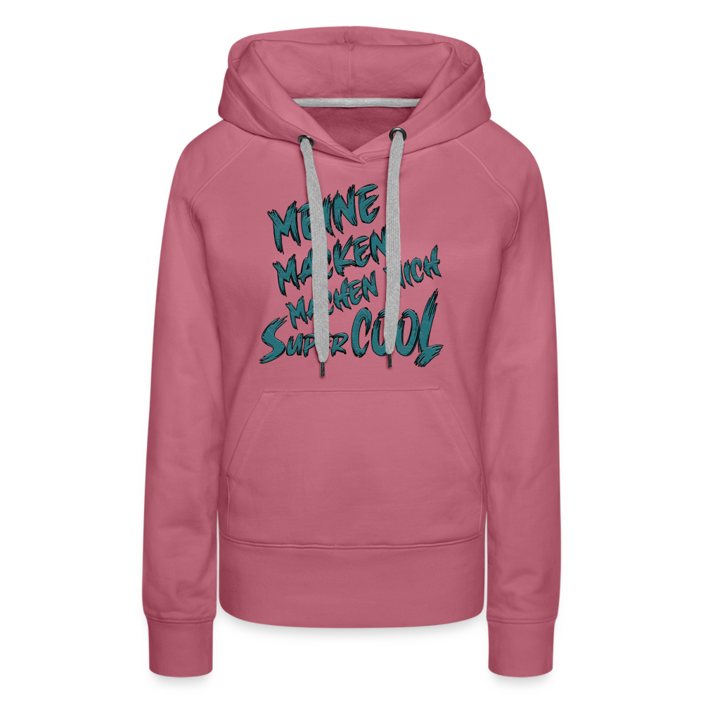 Farbe Malve Streetwear Hoodie für Frauen mit dem Spruch auf den Brust „Meine Macken machen mich super cool“. Stilvolle Typografie, lustige Sprüche, mit kontrastfarbigen Kapuzenband und praktischer Kängurutasche. Perfekt für Alltag und Freizeit.