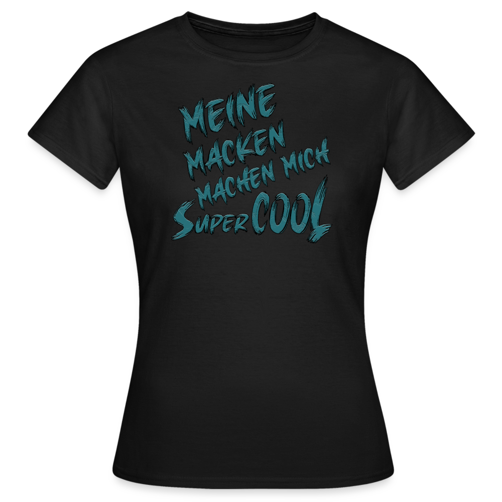 Schwarzes Frauen T-Shirt mit dem lustigen Spruch „Meine Macken machen mich super cool“. Humorvolles Streetwear-Design für individuelle Styles.