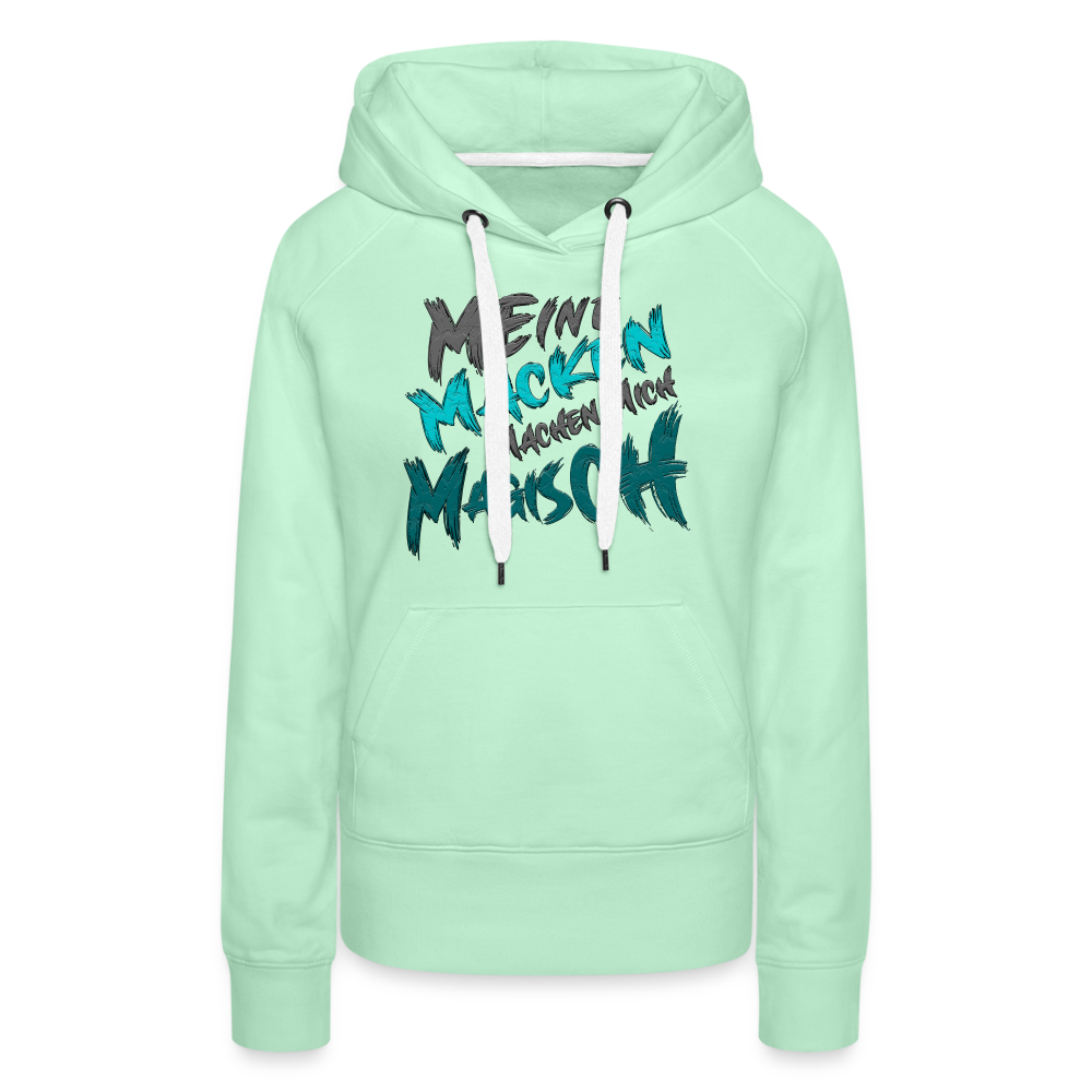 Mintgrüner Streetwear Hoodie für Frauen mit Statement ‚Meine Macken machen mich magisch‘, modernes Design mit weißer und schwarzer Schrift, kontrastfarbene Kapuzenbänder, Kängurutasche, ideal für lässigen Look, lustige Sprüche.