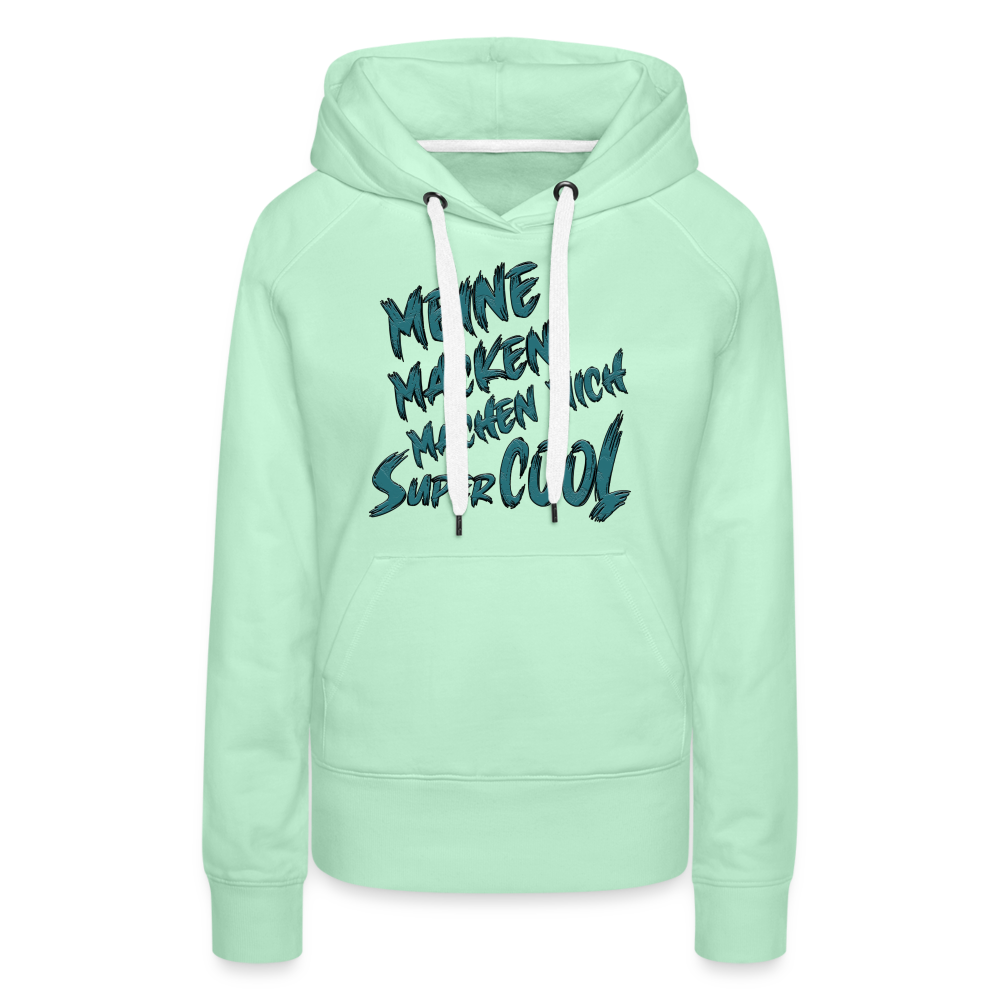 Mintgrüner Streetwear Hoodie für Frauen mit humorvollem Spruch „Meine Macken machen mich super cool“. Stilvolles Design in hellem Mintgrün, mit kontrastfarbigen Kapuzenbändern und praktischer Kängurutasche – perfekt für Alltag und Freizeit.